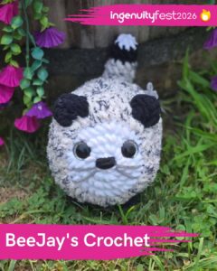 BeeJay's Crochet - IngenuityFest Vendor 2026 - Crochet white and black stuffed animal on the grass.